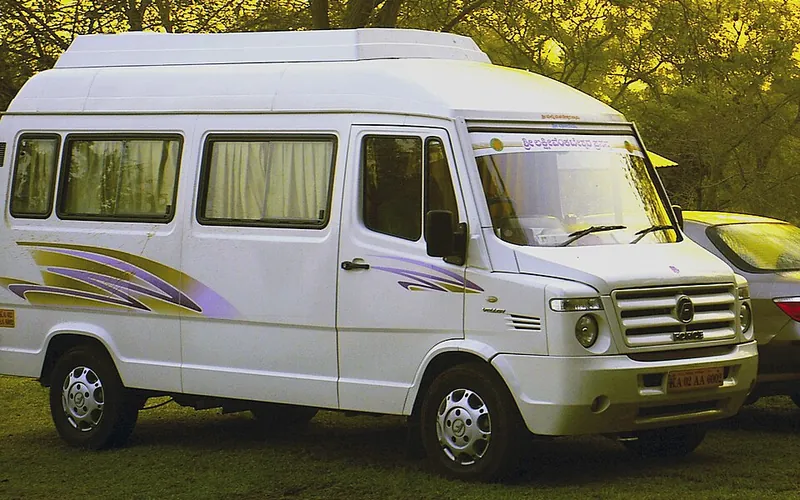 White Force Tempo Traveller minibus used for group taxi bookings, front three-quarter view